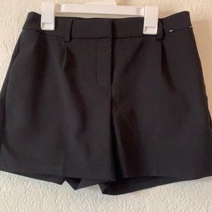 Black dress shorts.